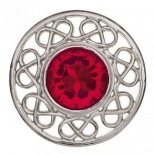 Circular Silver Brooch with pattern and red centre