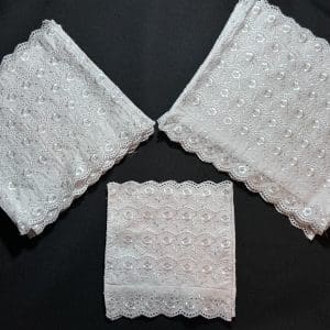 3 sets of highland dancing bibs on a black background